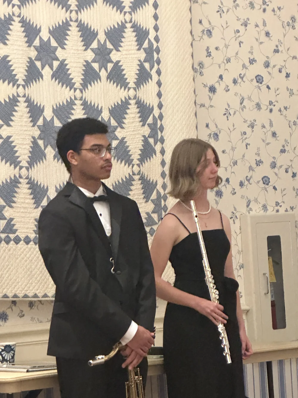 Two young musicians with saxophone and flute